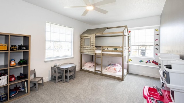 bedroom featuring ceiling fan and light colored carpet