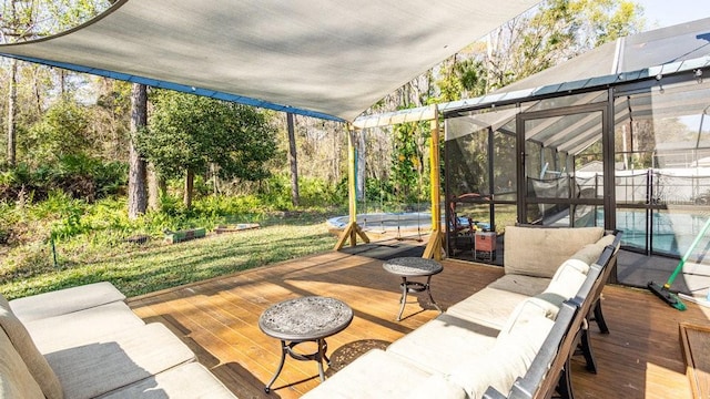 exterior space with an outdoor hangout area and glass enclosure