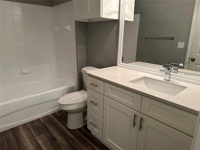 full bathroom featuring vanity, hardwood / wood-style flooring, shower / tub combination, and toilet