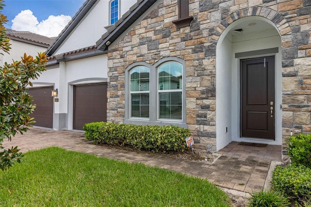 doorway to property featuring a garage