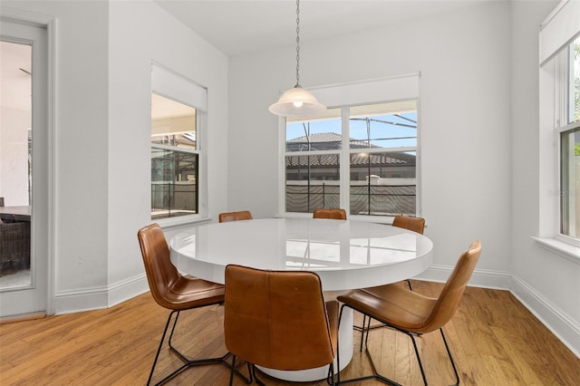 dining area featuring light wood-type flooring