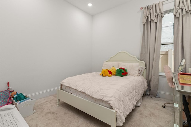 bedroom featuring light colored carpet