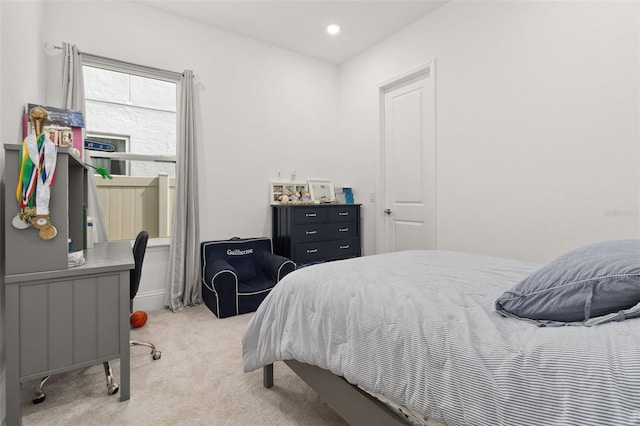 bedroom with light carpet