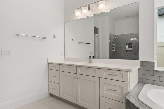 bathroom featuring vanity, tile patterned floors, and separate shower and tub