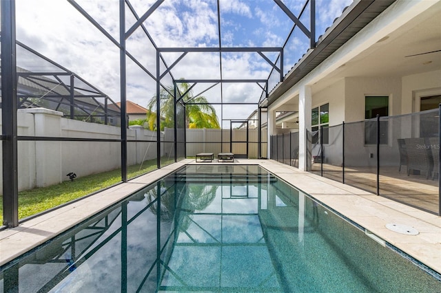 view of pool featuring a patio area and glass enclosure