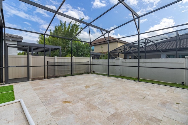 view of patio with glass enclosure