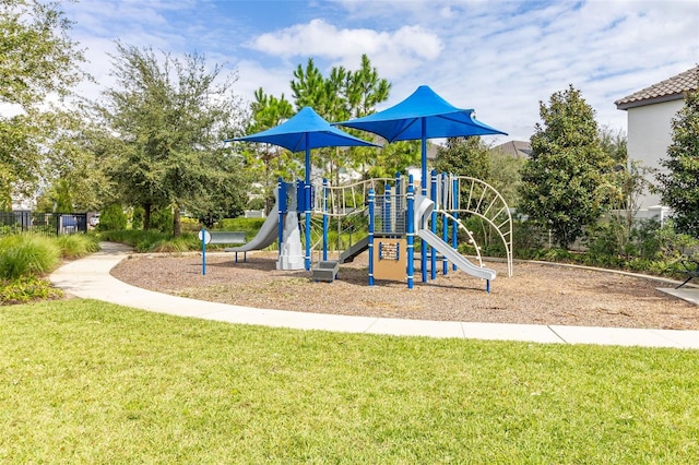 view of playground with a lawn