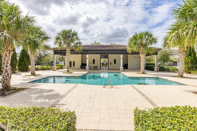 view of swimming pool with a patio area