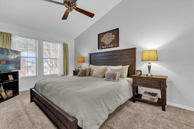 carpeted bedroom featuring lofted ceiling and ceiling fan