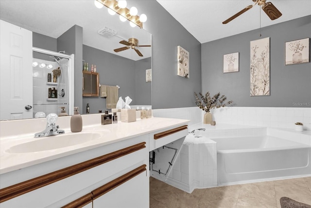 bathroom featuring tile patterned flooring, a tub to relax in, vanity, and ceiling fan