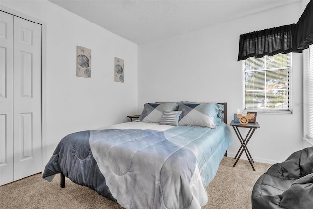 carpeted bedroom with a textured ceiling