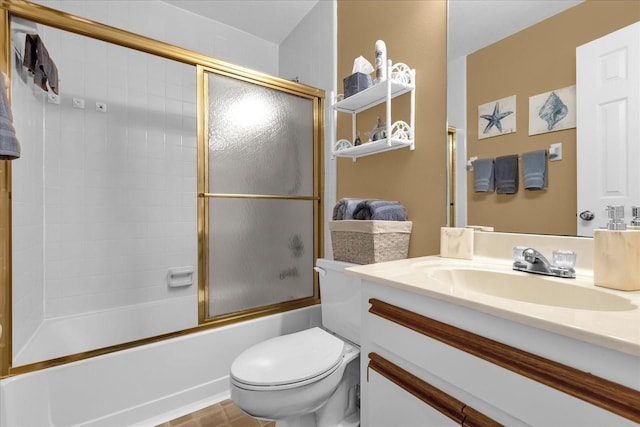 full bathroom with vanity, shower / bath combination with glass door, and toilet