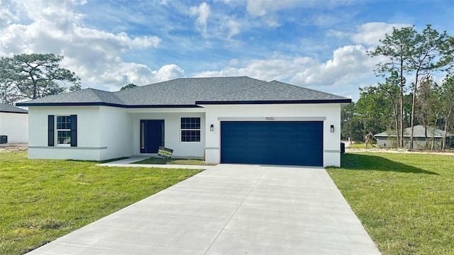 single story home with a garage, driveway, a front lawn, and stucco siding