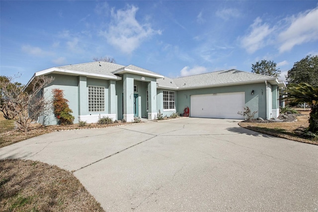 ranch-style house featuring a garage