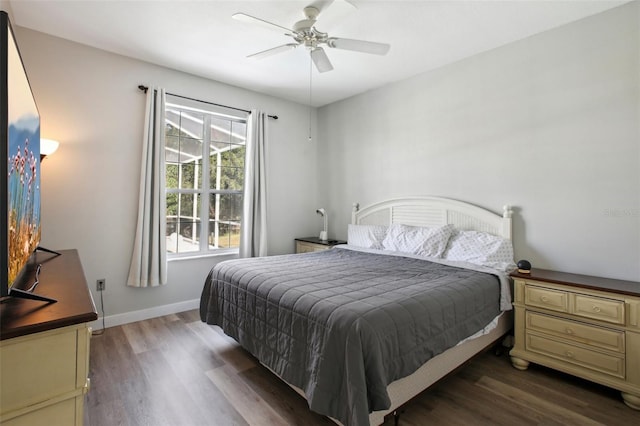 bedroom with ceiling fan and dark hardwood / wood-style floors