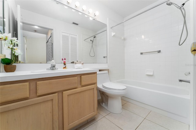 full bathroom featuring tile patterned floors, toilet, tiled shower / bath combo, and vanity