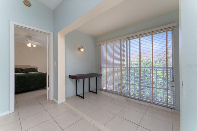 interior space featuring a healthy amount of sunlight and light tile patterned flooring