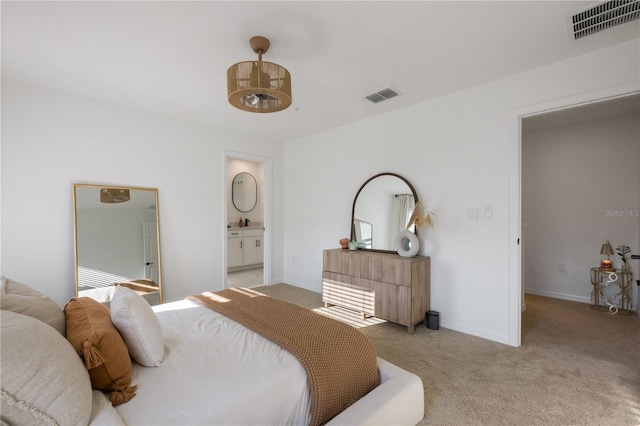 carpeted bedroom with connected bathroom