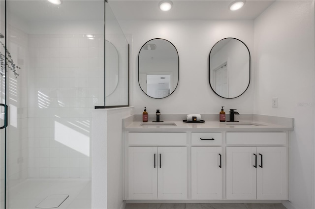 bathroom featuring vanity and a tile shower