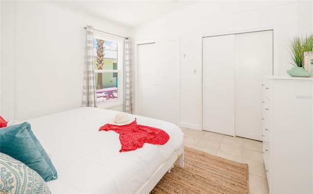 tiled bedroom with two closets