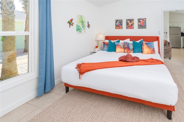 tiled bedroom with stainless steel refrigerator