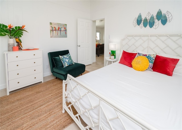 bedroom featuring light tile patterned floors