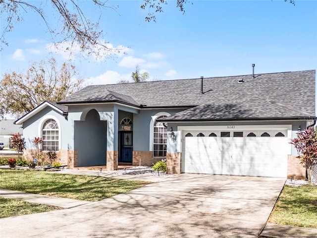 single story home with a garage and a front yard