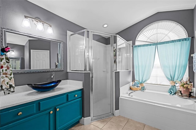 bathroom with tile patterned flooring, vanity, and independent shower and bath