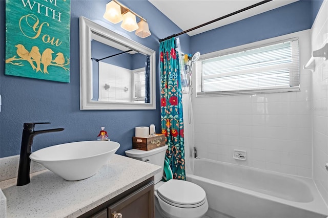 full bathroom with vanity, shower / bath combination with curtain, and toilet