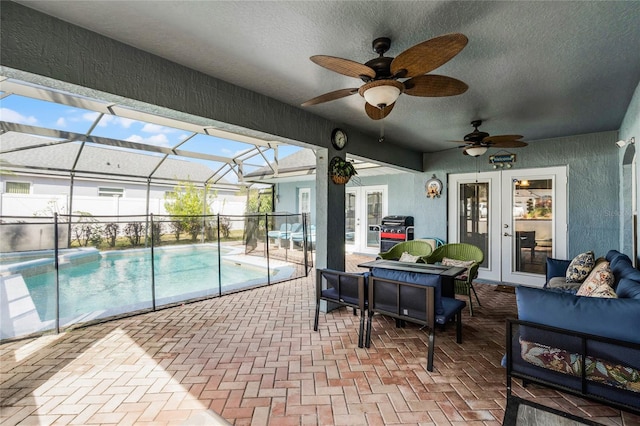 view of swimming pool featuring french doors, a patio area, grilling area, outdoor lounge area, and a lanai