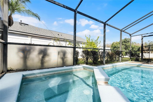 view of swimming pool with glass enclosure