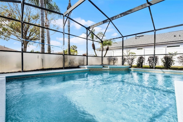 view of pool featuring an in ground hot tub and glass enclosure