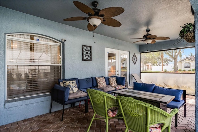 exterior space with french doors and ceiling fan