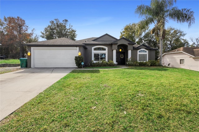 ranch-style home featuring a garage and a front yard