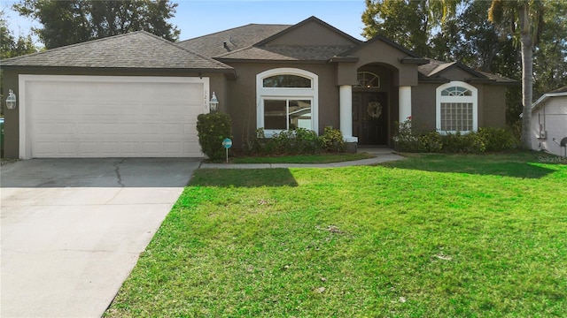 ranch-style home with a garage and a front lawn