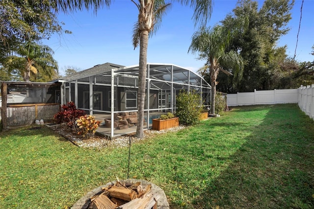 view of yard featuring glass enclosure