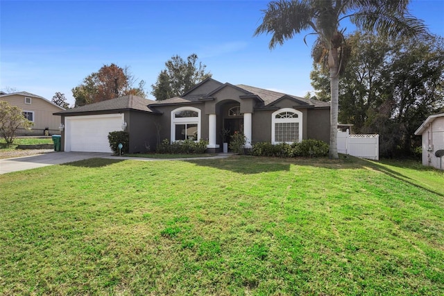 single story home featuring a garage and a front yard