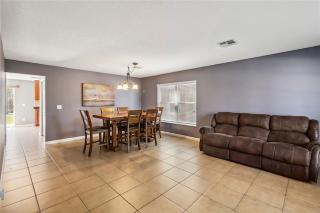 tiled dining space with a healthy amount of sunlight