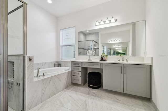 bathroom featuring vanity and separate shower and tub