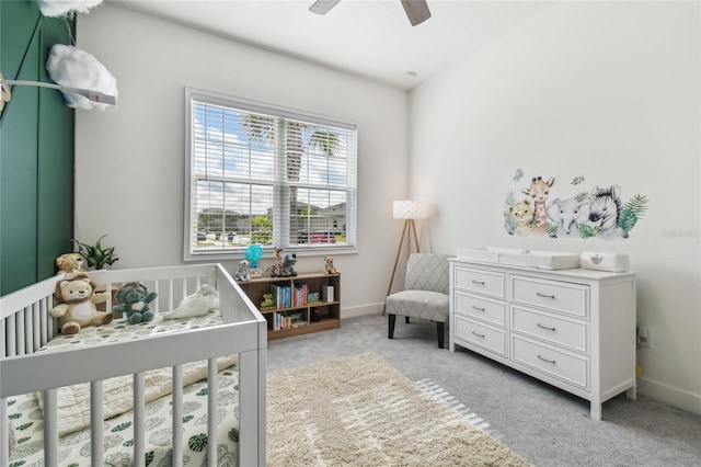 bedroom with ceiling fan and light carpet