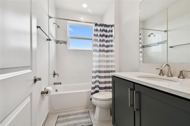 full bathroom with vanity, shower / bath combination with curtain, and toilet