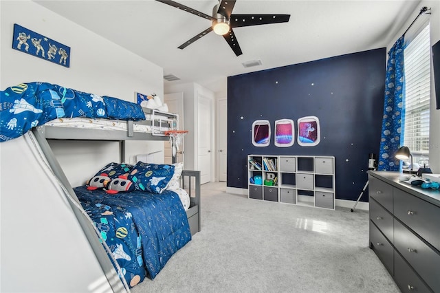 bedroom featuring light carpet and ceiling fan