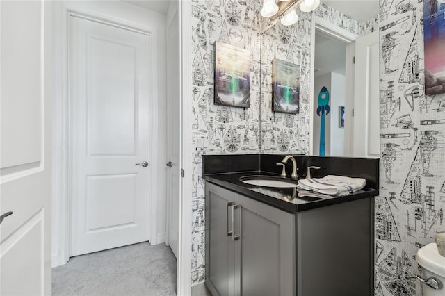 bathroom featuring vanity and toilet