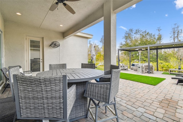 view of patio / terrace featuring ceiling fan