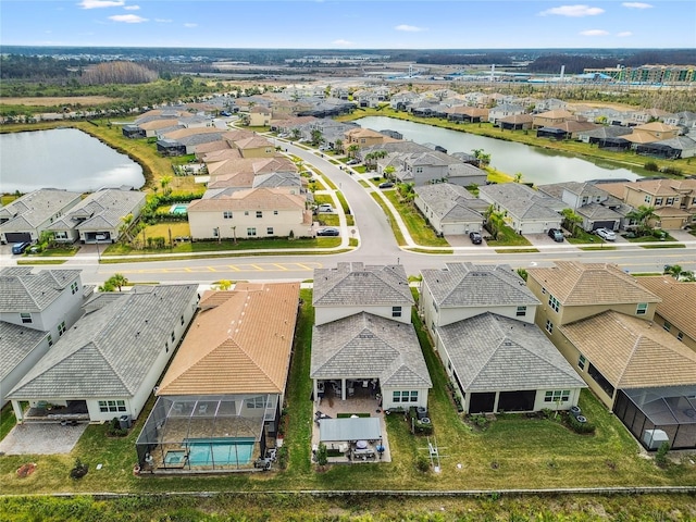 drone / aerial view with a water view