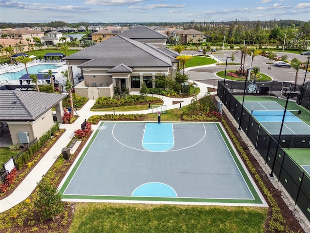 view of basketball court featuring tennis court