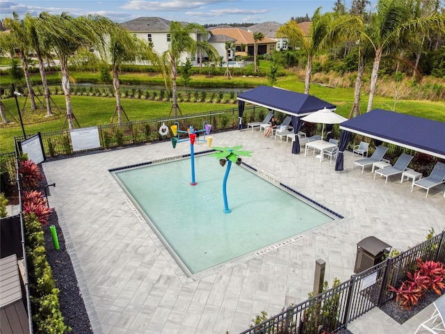 surrounding community featuring a pool, a gazebo, and a patio