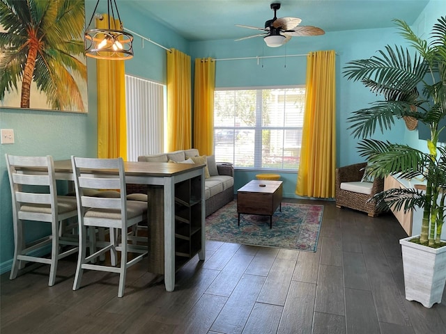 dining area featuring dark wood-type flooring and ceiling fan