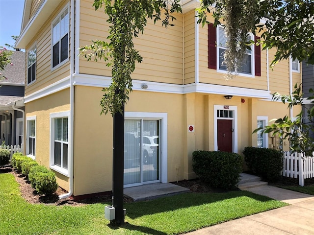 entrance to property with a yard