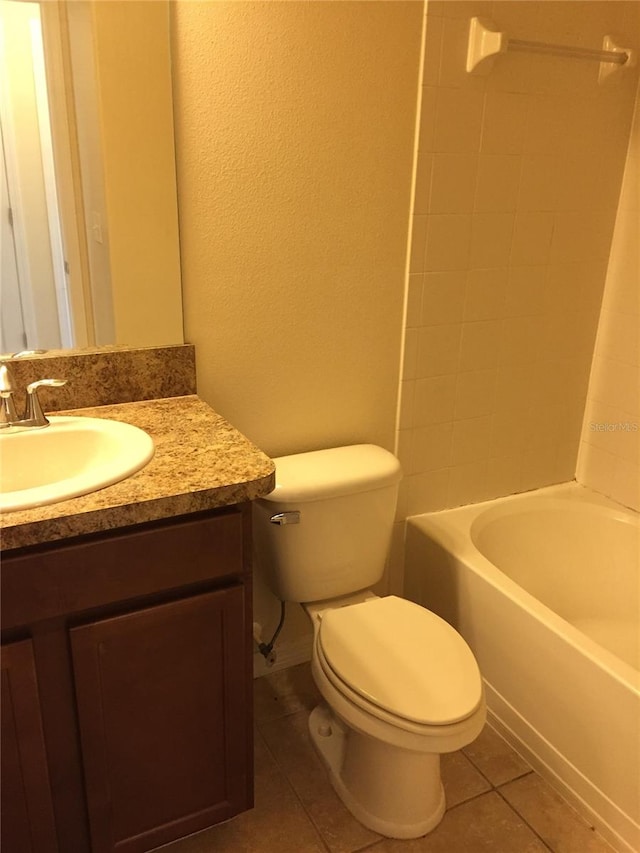 full bathroom featuring vanity,  shower combination, tile patterned floors, and toilet